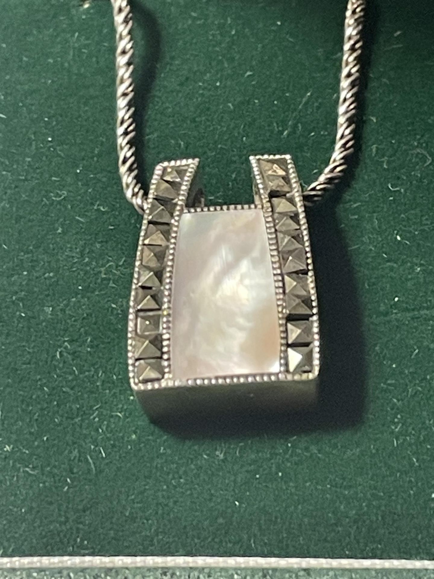 A SILVER NECKLACE WITH A MOTHER OF PEARL AND MARCASITE DECO STYLE PENDANT IN A PRESENTATION BOX - Image 2 of 3