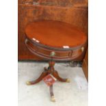 A MAHOGANY AND CROSSBANDED DRUM TABLE BY J. SYDNEY-SMITH ENCLOSING TWO DRAWERS 19.5" DIAMETER,