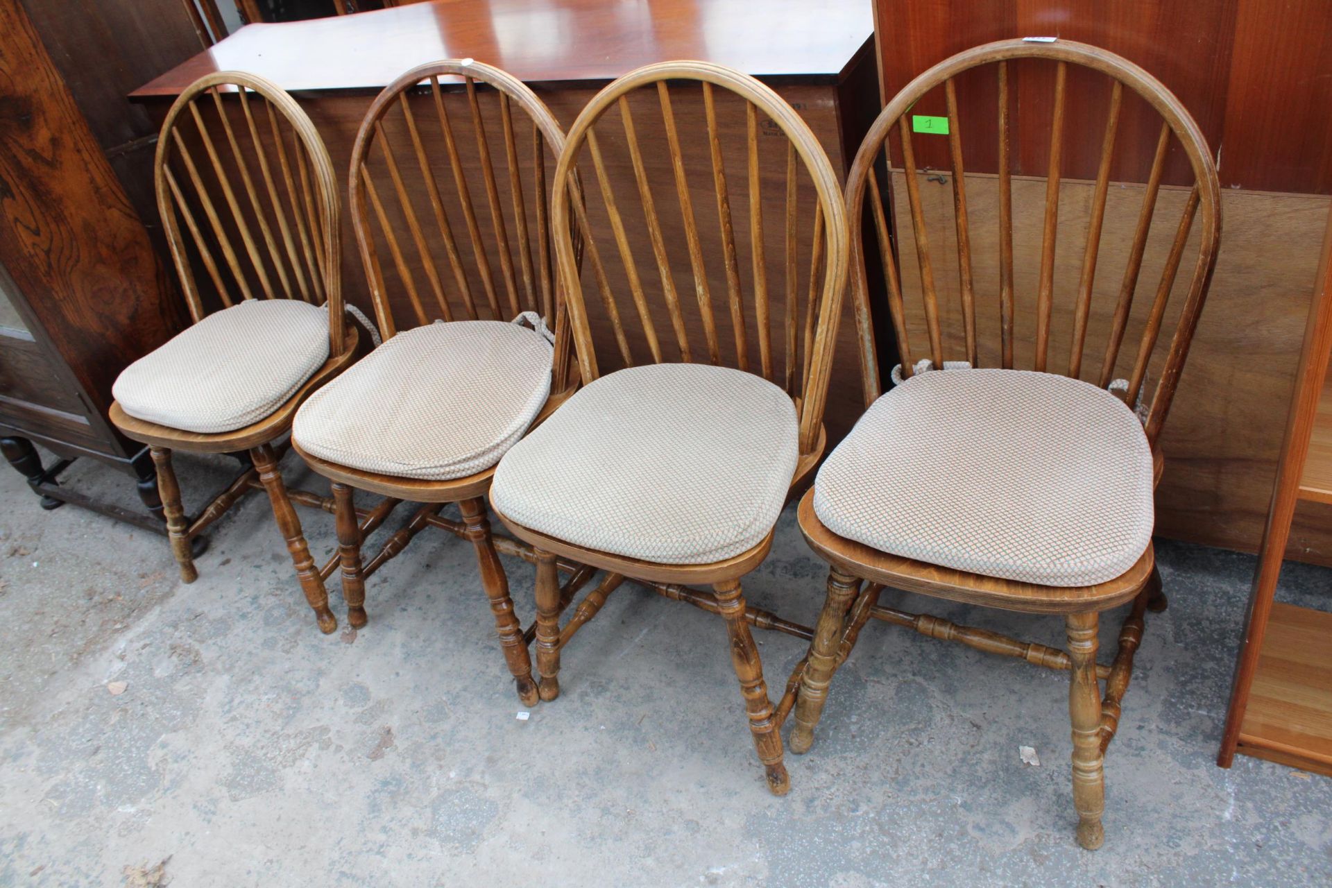 A SET OF FOUR BEECH FRAMED WINDSOR STYLE SPINDLE BACK DINING CHAIRS