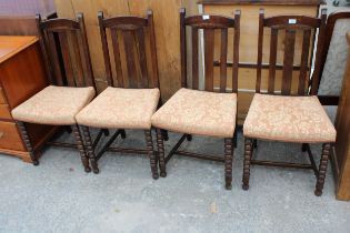 A SET OF FOUR OAK EARLY 20TH CENTURY DINING CHAIRS ON BOBBIN TURNED LEGS