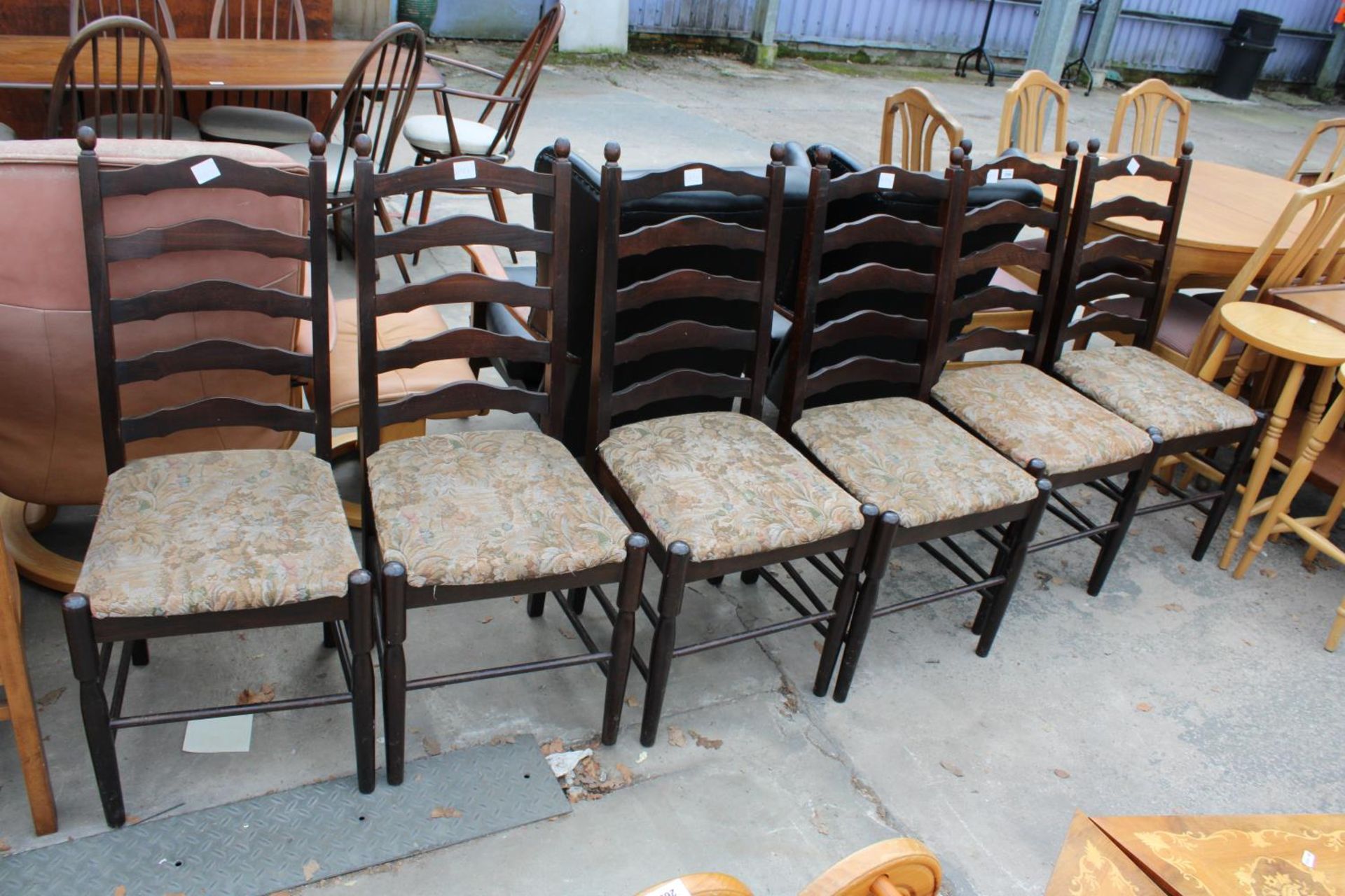A SET OF SIX MODERN LADDER-BACK DINING CHAIRS
