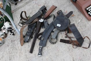 AN ASSORTMENT OF ITEMS TO INCLUDE A SCABBARD, A GUN AND BELTS ETC