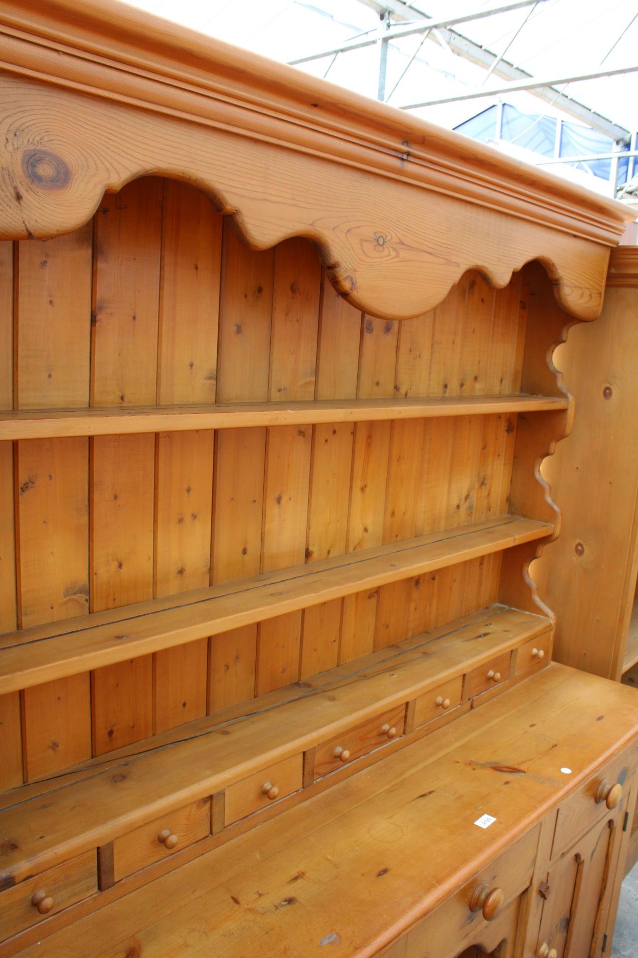 A VICTORIAN STYLE PINE KITCHEN DRESSER WITH PLATE RACK ENCLOSING SEVEN SPICE DRAWERS, THE BASE - Image 3 of 3