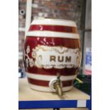A LARGE STONEWARE RUM KEG WITH TAP. APPROX HEIGHT 30.5CM.