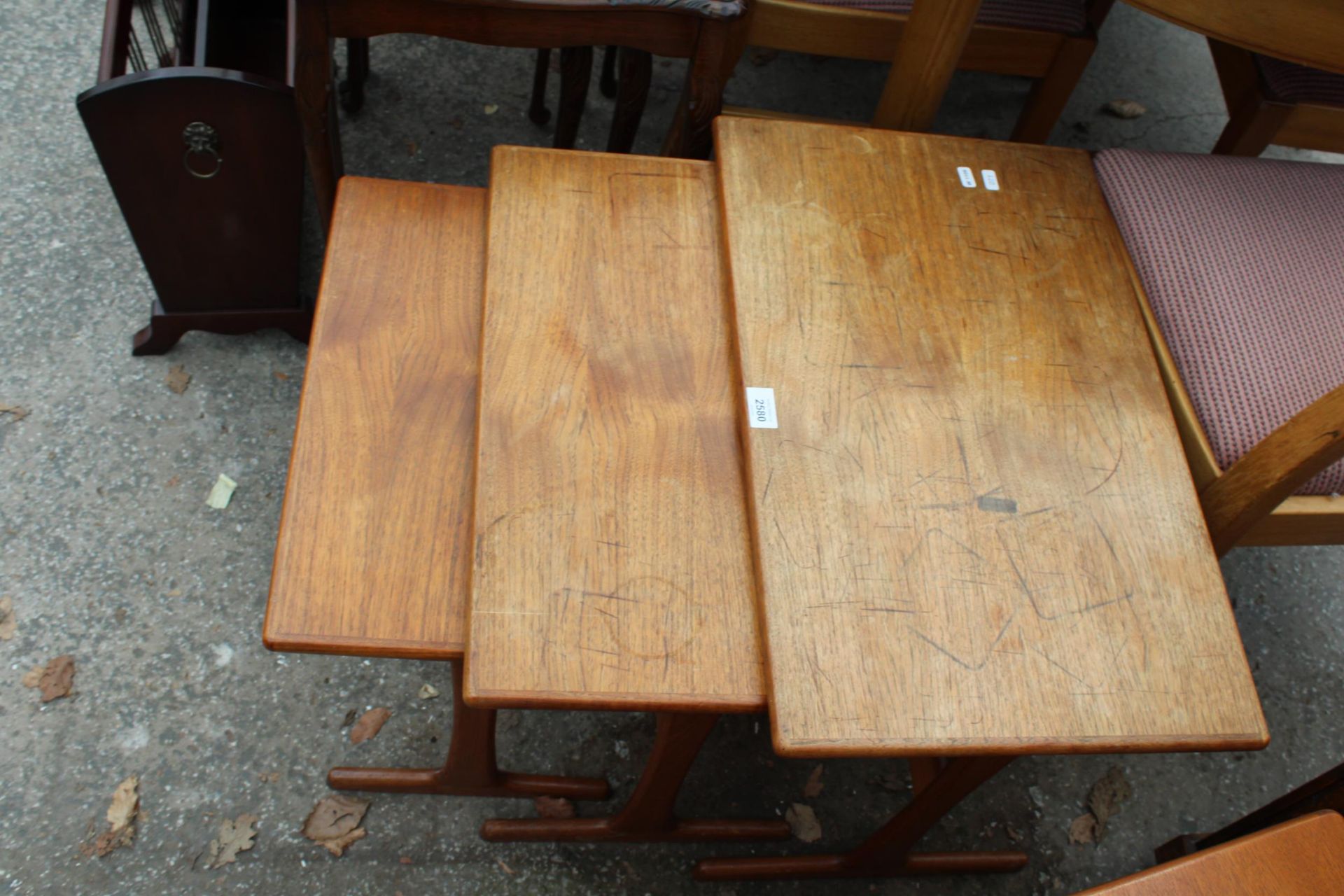A RETRO TEAK NEST OF THREE TABLES STAMPED 'MADE IN DENMARK' - Image 3 of 3