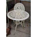A CAST ALLOY BISTRO SET COMPRISING OF A ROUND TABLE AND ONE CHAIR