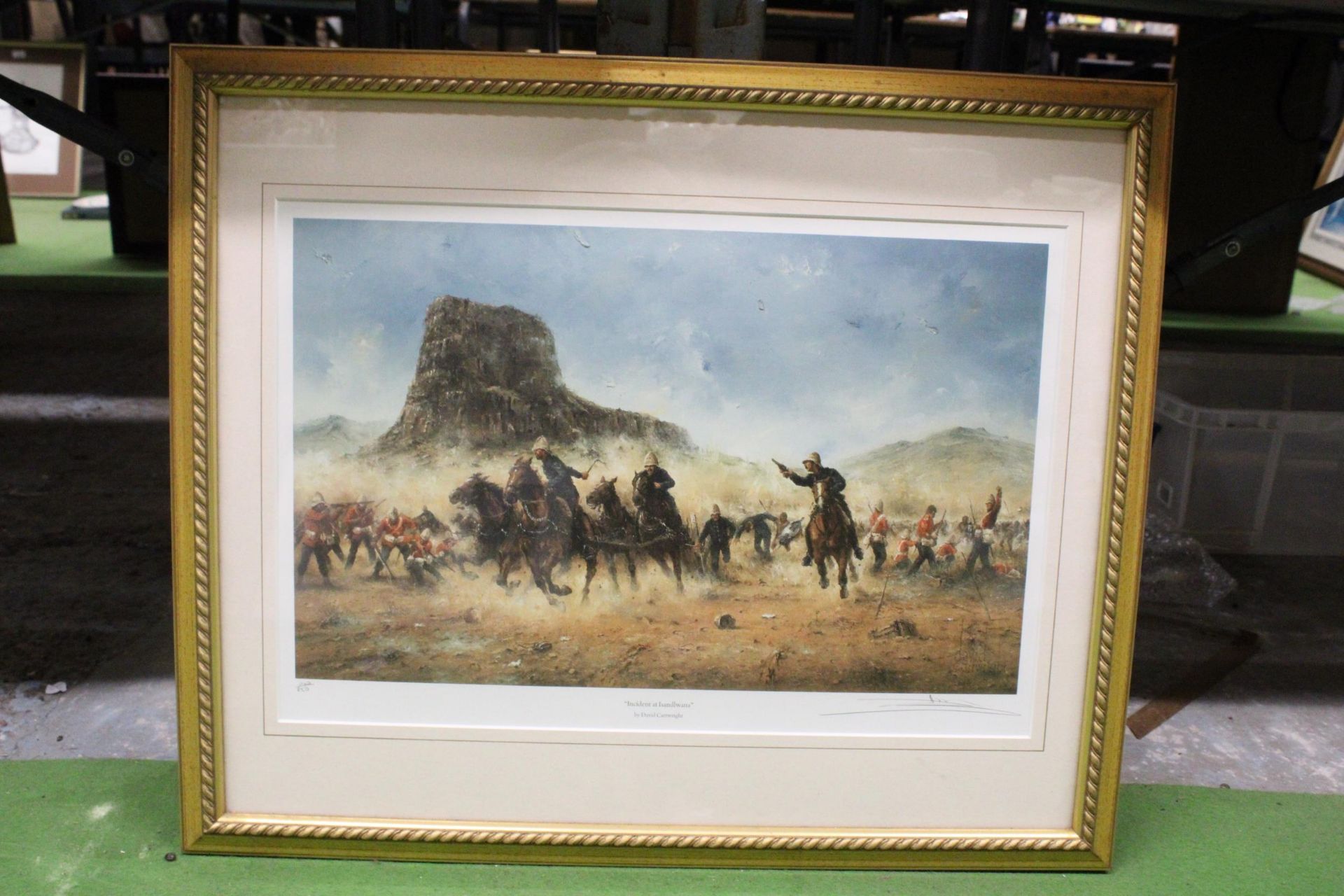 A FRAMED PRINT TITLED, 'INCIDENT A ISANDLWANA', SIGNED