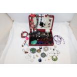 A BOX CONTAINING VINTAGE COSTUME JEWELLERY TO INCLUDE BROOCHES, RINGS, NECKLACES, ETC.,