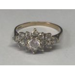 A 9 CARAT GOLD RING WITH CUBIC ZIRCONIAS IN A CLUSTER DESIGN SIZE O