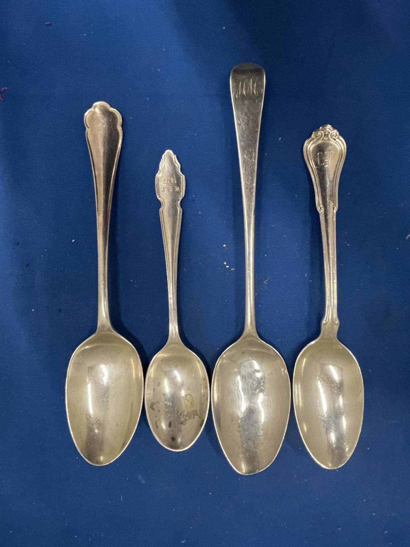 FOUR HALLMARKED SILVER SPOONS TO INCLUDE ONE PRE 1820 LONDON, TWO SHEFFIELD AND A BIRMINGHAM