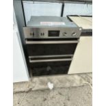 A CHROME AND BLACK BAUMATIC INTERGRATED DOUBLE OVEN