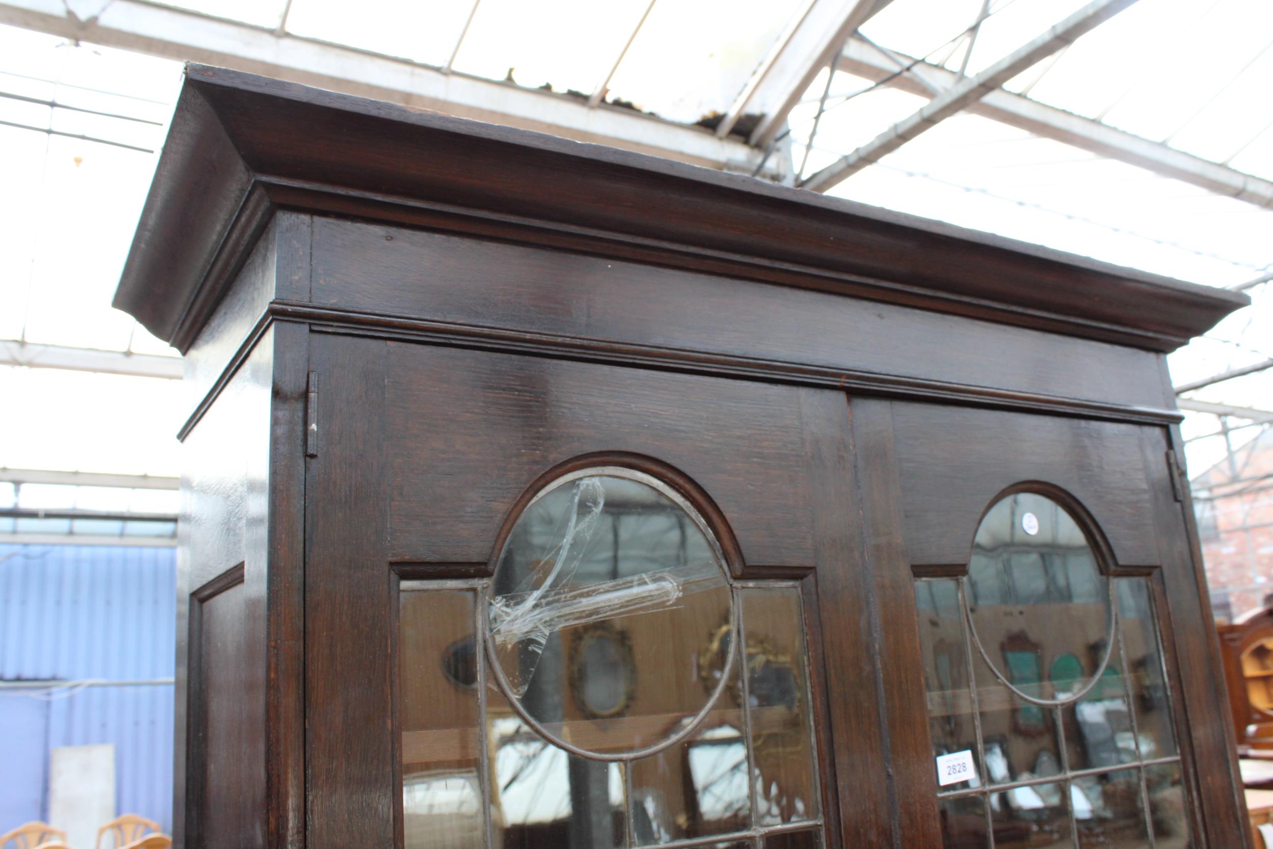 AN OAK ART NOUVEAU GLAZED AND LEADED TWO DOOR DISPLAY CABINET WITH CUPBOARDS TO BASE, 41" WIDE, - Image 2 of 6