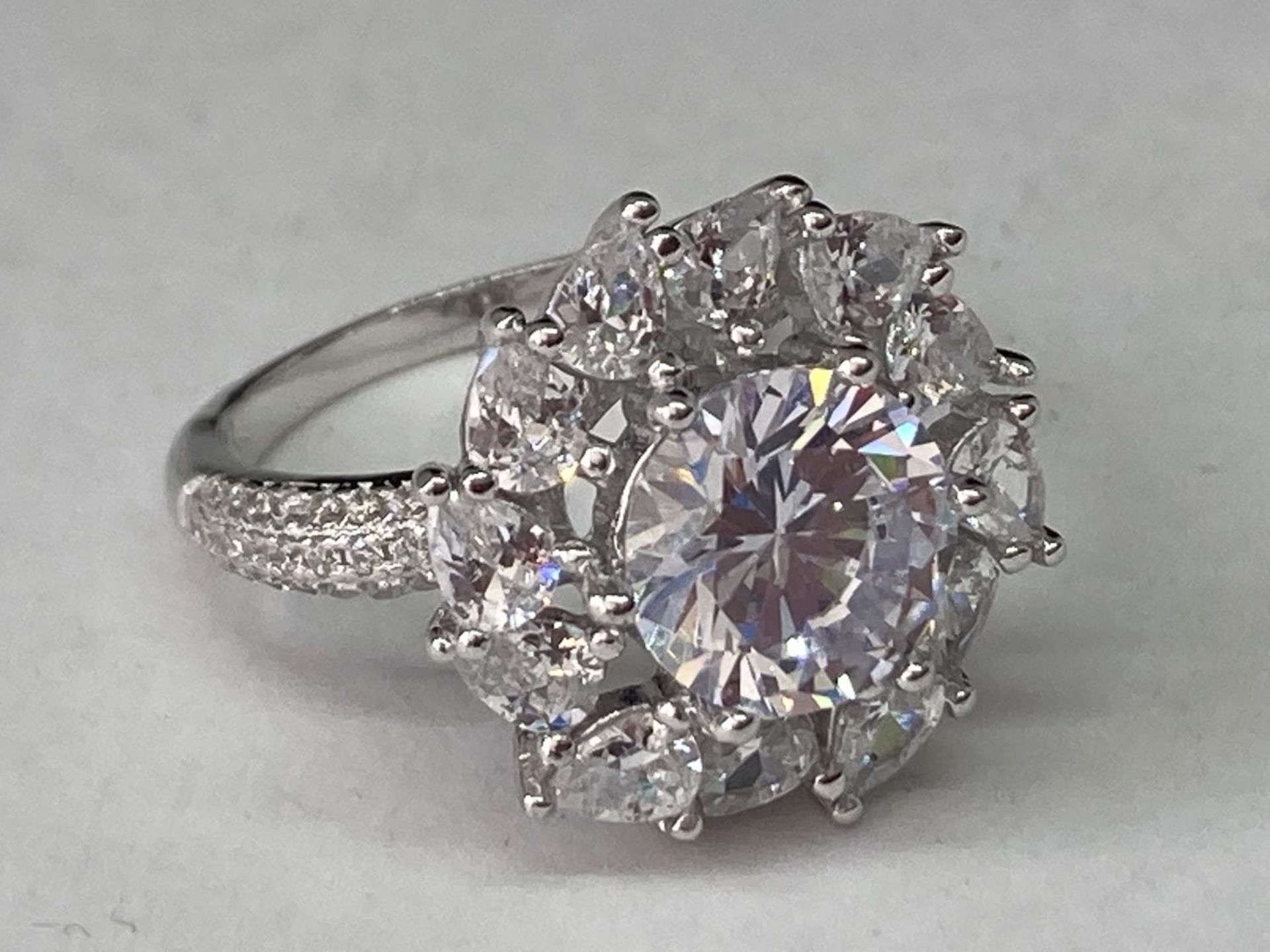 A WHITE METAL RING WITH 3 CARATS OF MOISSANITE IN A CLUSTER DESIGN SIZE Q - Image 2 of 6