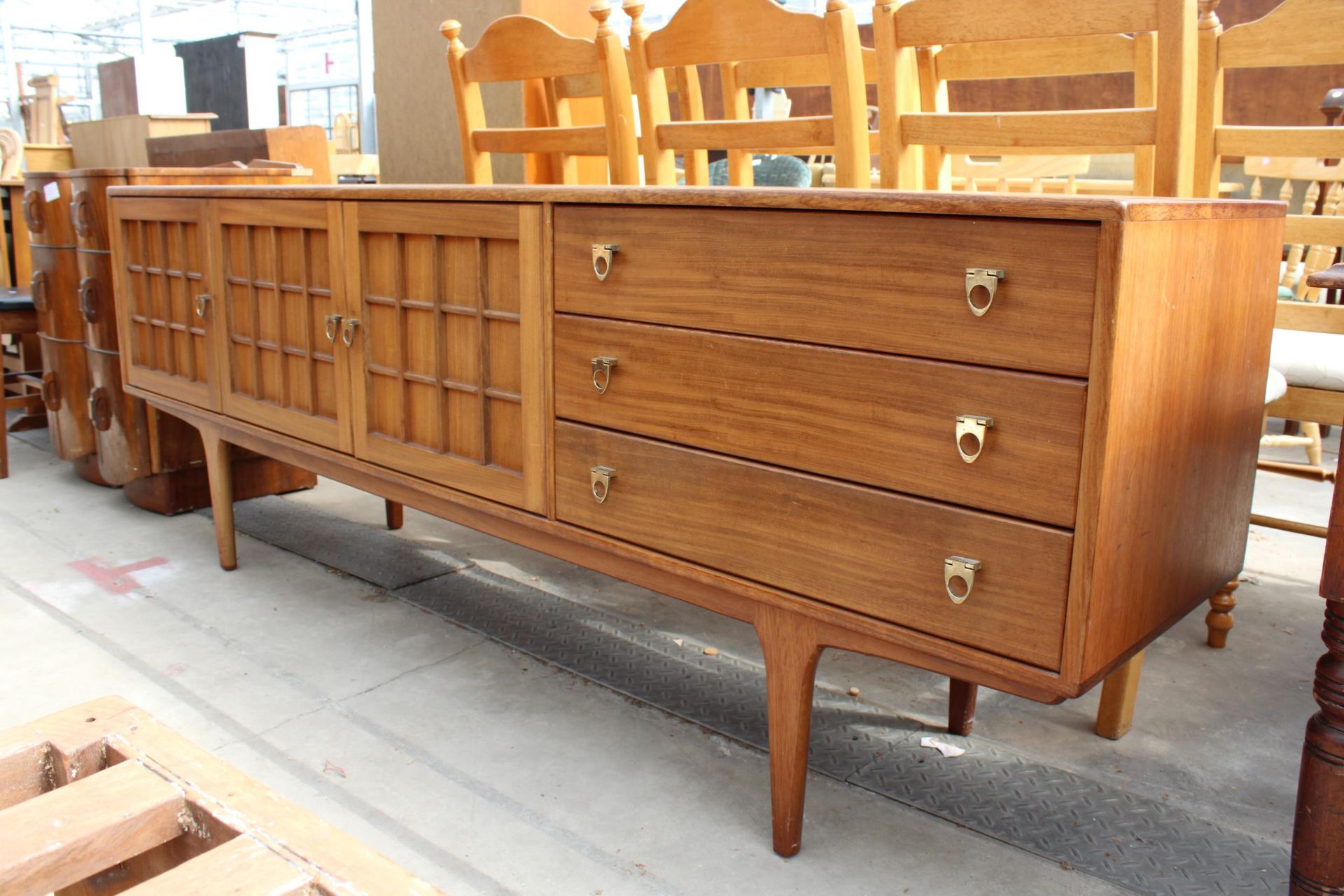 A RETRO TEAK YOUNGER SIDEBOARD ENCLOSING THREE CUPBOARDS, THREE DRAWERS, 81" WIDE - Image 2 of 5