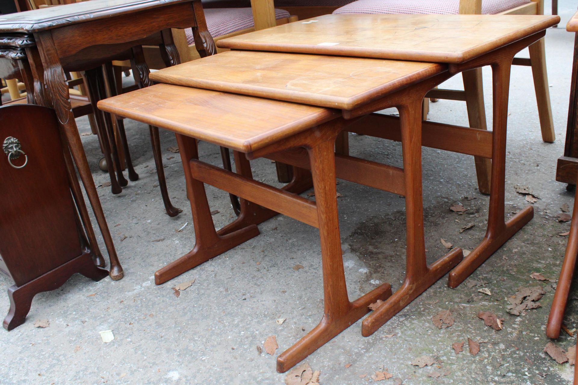 A RETRO TEAK NEST OF THREE TABLES STAMPED 'MADE IN DENMARK' - Image 2 of 3