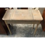 AN EARLY 20TH CENTURY OAK 'THE BRITISHER DESK' WITH FOLD-OUT WRITING AND STORAGE SECTIONS, 36" WIDE