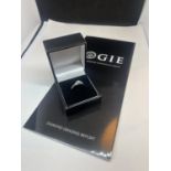 A 9 CARAT WHITE GOLD RING WITH CENTRE BLUE TOPAZ SHOULDERED BY DIAMONDS SIZE N IN A PRESENTATION BOX