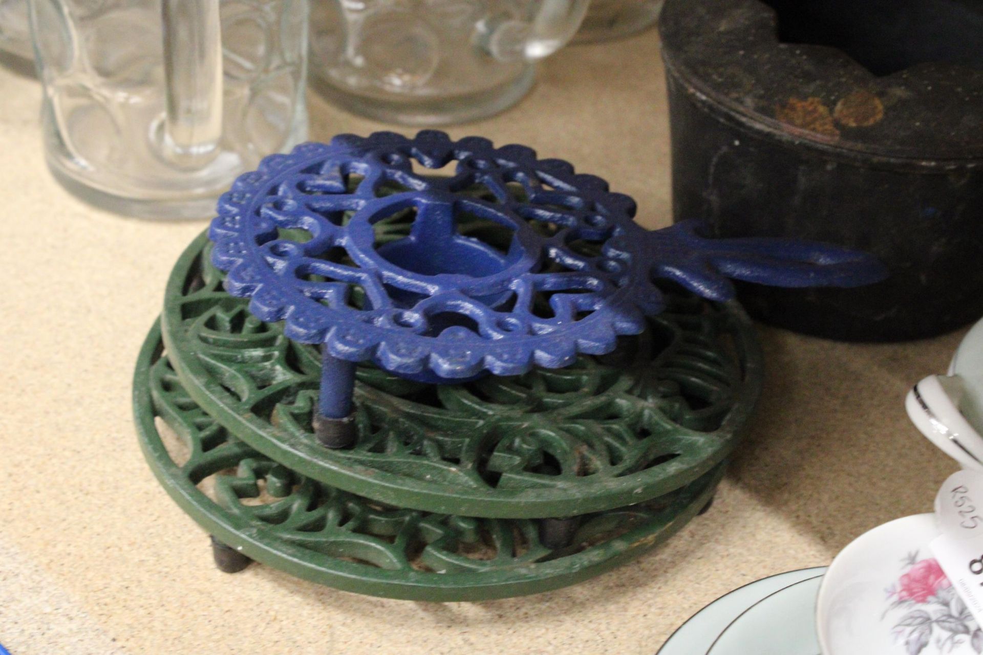 A CAST IRON COOK POT ON STAND PLUS TWO KETTLE STANDS AND CANDLE HOLDER - Image 3 of 4