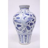 A LARGE CHINESE MING STYLE BLUE AND WHITE POTTERY MEIPING VASE DECORATED WITH CRANES IN FLIGHT -