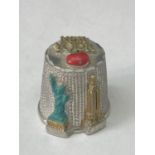 A VINTAGE PEWTER THIMBLE DEPICTING NEW YORK