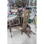 A WOODEN SLATTED GARDEN CHAIR AND BENCH BOTH FOR RESTORATION AND WITH CAST ENDS AND BACK