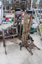A WOODEN SLATTED GARDEN CHAIR AND BENCH BOTH FOR RESTORATION AND WITH CAST ENDS AND BACK