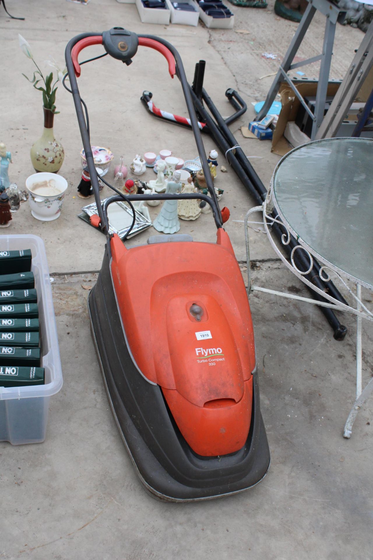 AN ELECTRIC FLYMO TURBO COMPACT 330 LAWN MOWER