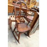 A WINDSOR STYLE ELM AND BEECH ROCKING CHAIR WITH PIERCED SPLAT HIGH BACK