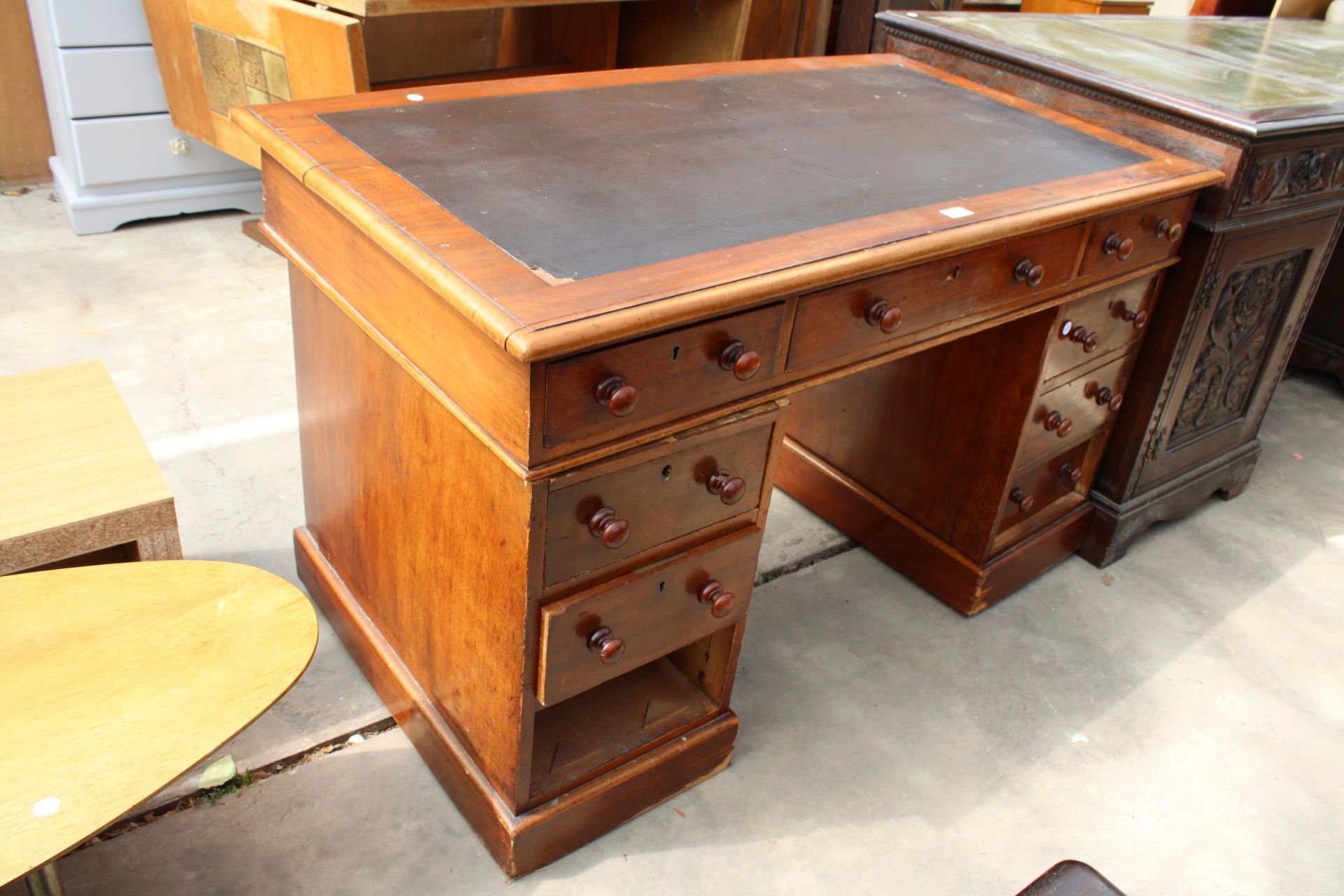 A VICTORIAN MAHOGANY TWIN-PEDESTAL DESK ENCLOSING NINE DRAWERS, 47" X 26" - Image 2 of 2