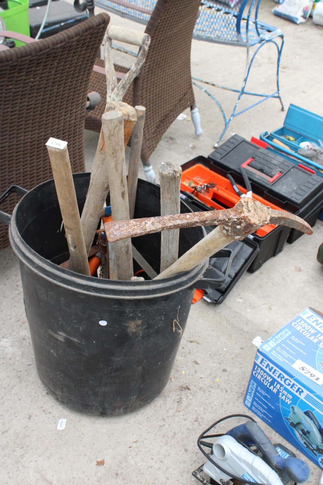 A PLASTIC BIN WITH AN ASSORTMENT OF TOOLS TO INCLUDE A PICK AXE AND A SHOVEL ETC