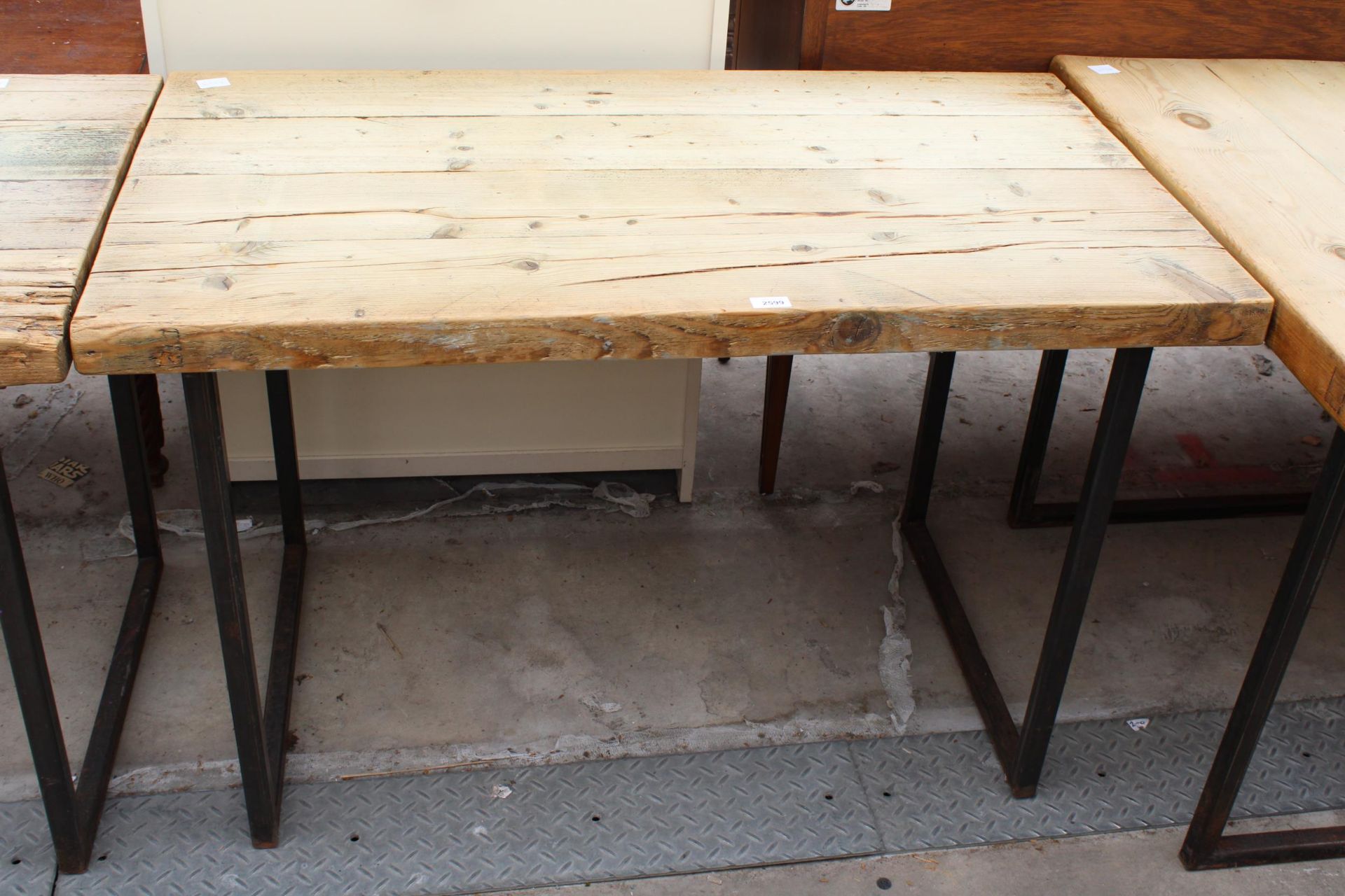 A RUSTIC FOUR PLANK TABLE, 47" X 27" ON METAL LEGS
