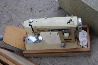 A RETRO ELECTRIC SEWING MACHINE AND FOUR FRAMED PRINTS