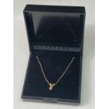 A 9 CARAT GOLD NECKLACE WITH A 9 CARAT GOLD AND DIAMOND PENDANT IN A PRESENTATION BOX