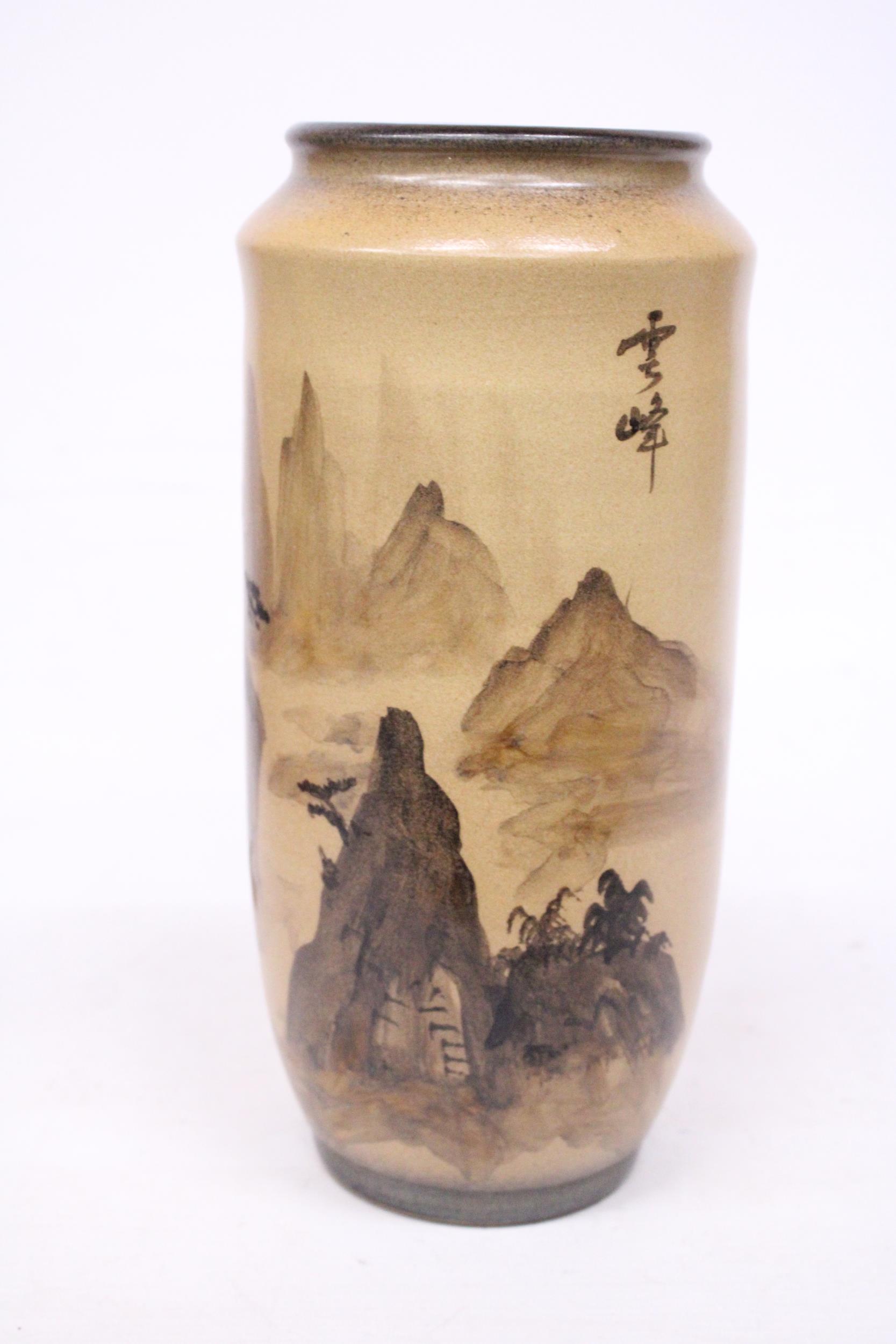 A JAPANESE STONEWARE VASE WITH AN ORIENTAL LANDSCAPE SCENE WITH SIGNATURE - 29 CM