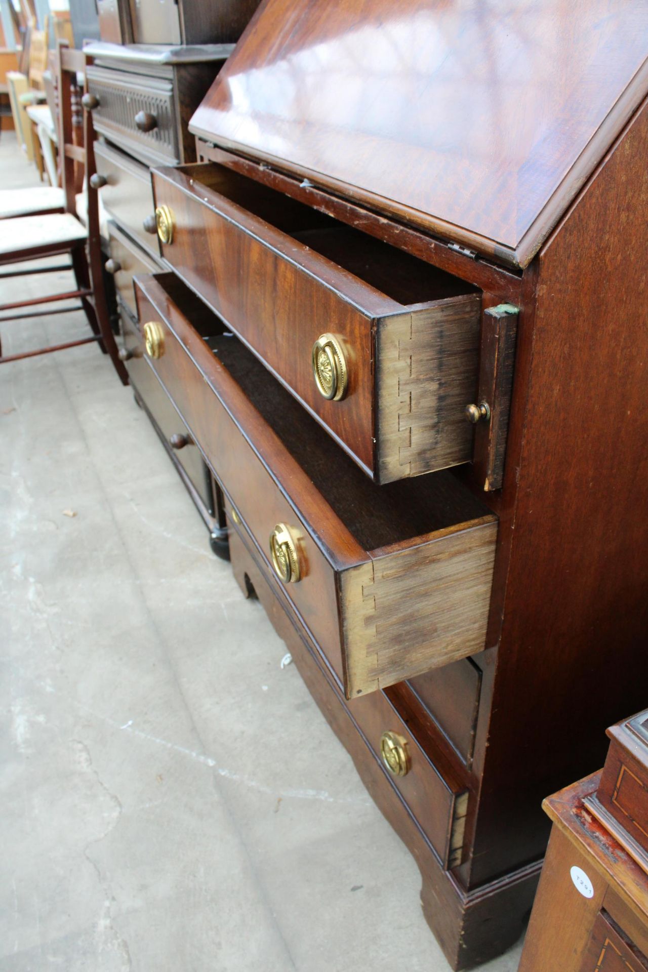 A REPRPDUCTION MAHOGANY AND CROSSBANDED BUREAU, 29.5" WIDE - Image 4 of 4