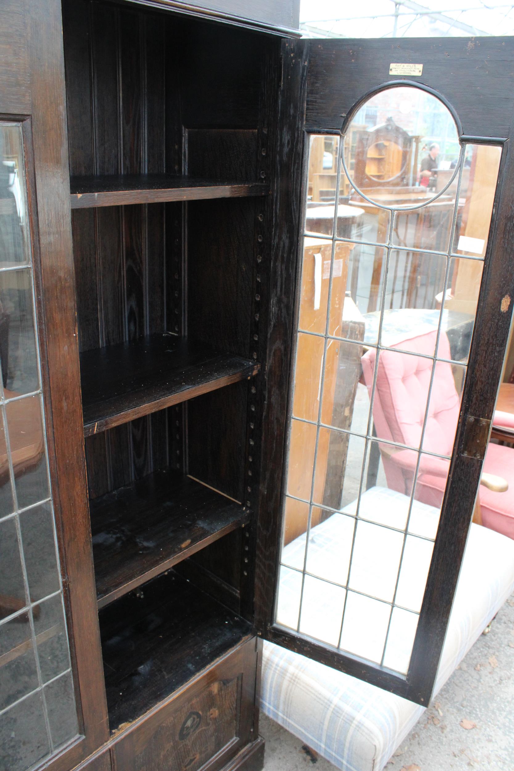 AN OAK ART NOUVEAU GLAZED AND LEADED TWO DOOR DISPLAY CABINET WITH CUPBOARDS TO BASE, 41" WIDE, - Image 4 of 6