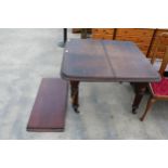 A VICTORIAN MAHOGANY WIND-OUT DINING TABLE ON FLUTED LEGS, 41" SQUARE (LEAF 17") COMPLETE WITH