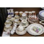 A MIXED LOT OF TEAWARE TO INCLUDE CUPS, SAUCERS, SIDE PLATES. CAKE PLATES, CREAM JUG SUGAR BOWL ETC