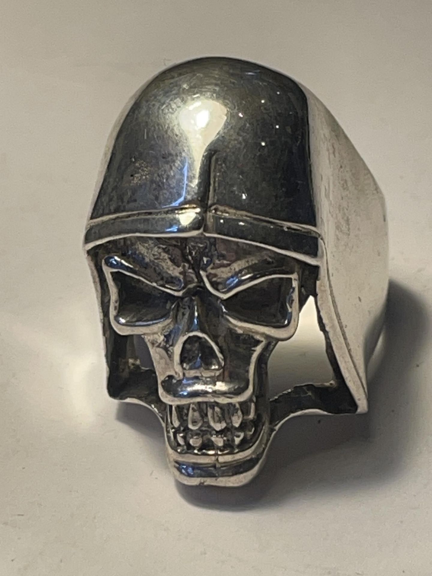 A MARKED SILVER HEAVY SKULL RING