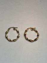 A PAIR OF MARKED 375 GOLD TWIST EARRINGS
