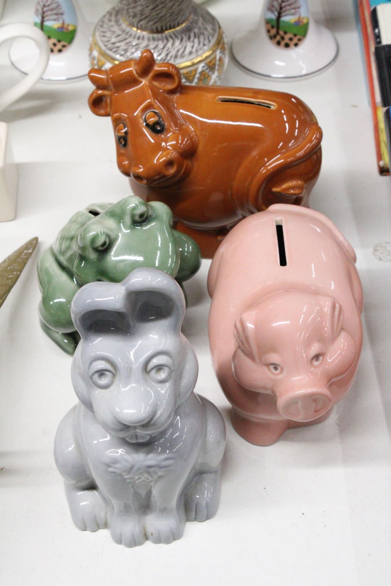 FOUR CERAMIC WADE ANIMAL THEMED MONEY BOXES