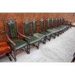 A SET OF TEN OAK JACOBEAN STYLE HIGH BACK DINING CHAIRS, TWO BEING CARVERS ON TURNED LEGS AND