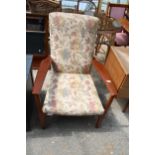 A PARKER KNOLL FIRESIDE CHAIR MODEL NO. P.K.988-1023