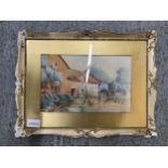 A FRAMED WATERCOLOUR OF A COTTAGE GARDEN SCENE