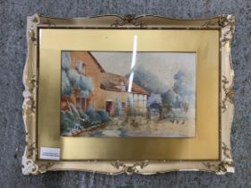 A FRAMED WATERCOLOUR OF A COTTAGE GARDEN SCENE