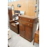 A MID 20TH CENTURY OAK TALLBOY AND DRESSING TABLE