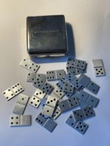 A VINTAGE BURBERRY MINIATURE POCKET SIZED DOMINO SET WITH TWENTY SEVEN DOMINOES