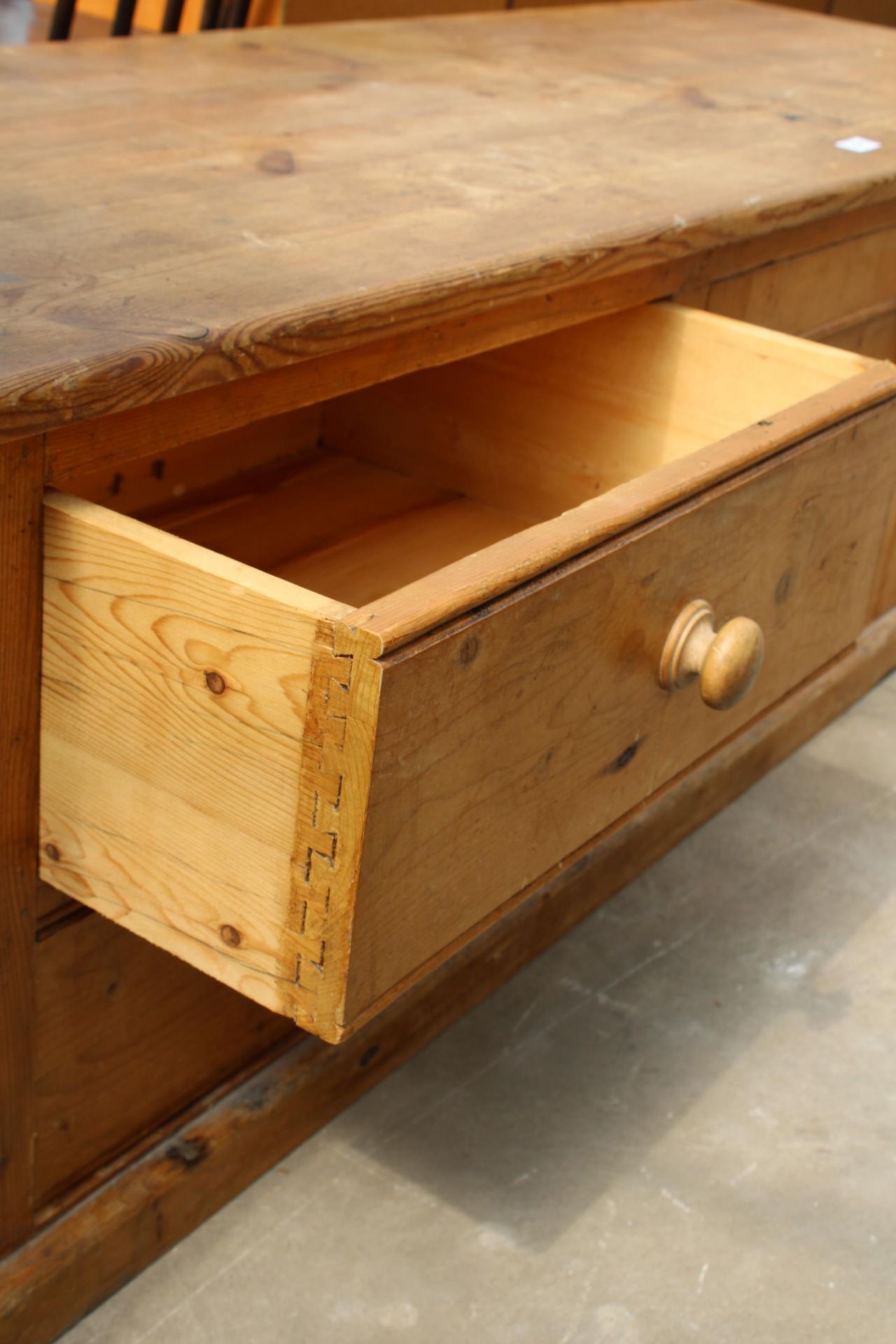 A MODERN PINE LOW CUPBOARD ENCLOSING TWO DRAWERS AND CUPBOARDS, 66" WIDE - Image 4 of 4