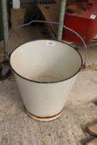 A BLUE AND WHITE ENAMELED BUCKET