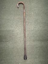 A WALKING CANE WITH A HALLMARKED SILVER FERRULE AND HANDLE TIP
